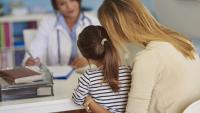 kid and parent at the doctor